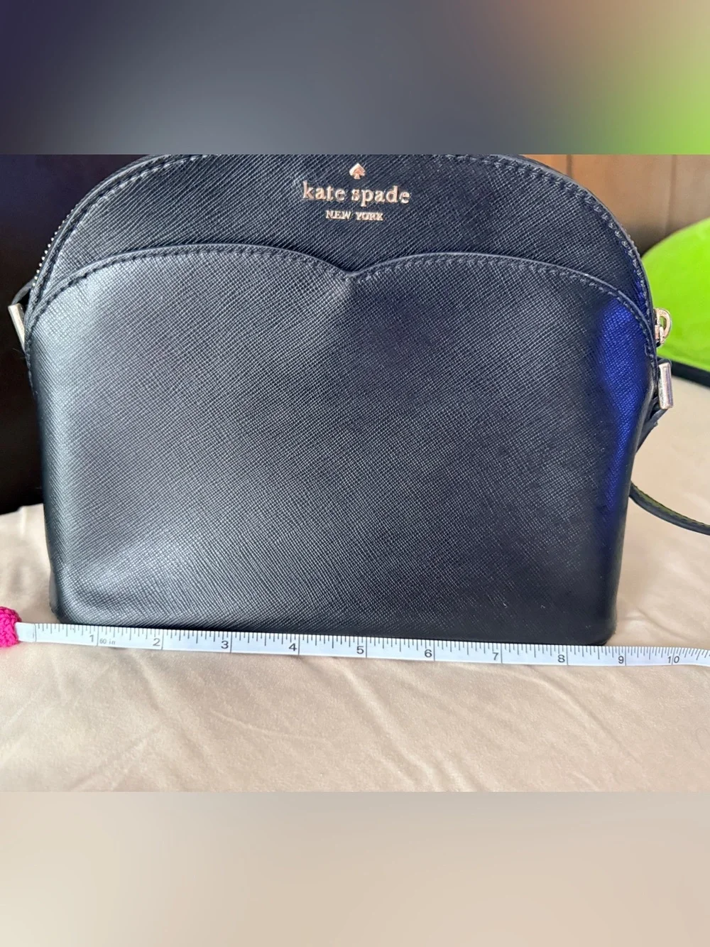 Kate Spade New York Payton Dome Crossbody in black saffiano leather.